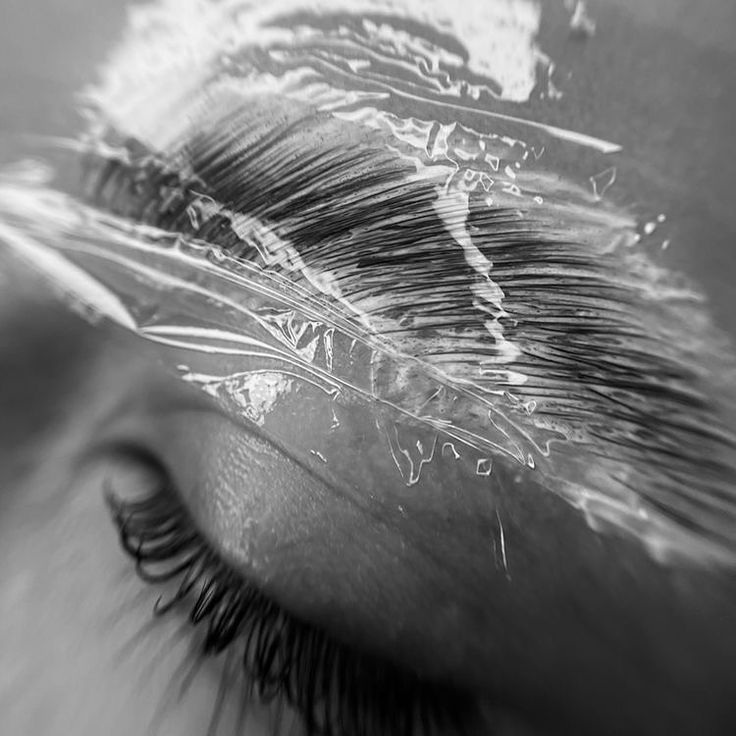 Brow lamination treatment with tint and wax on client's eyebrows for a fuller, defined look.